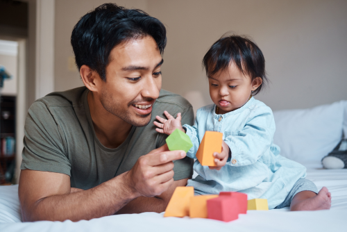 Caregiver and child playing with blocks